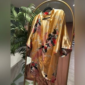 Vibrant Gold Robe with Peacock Motif